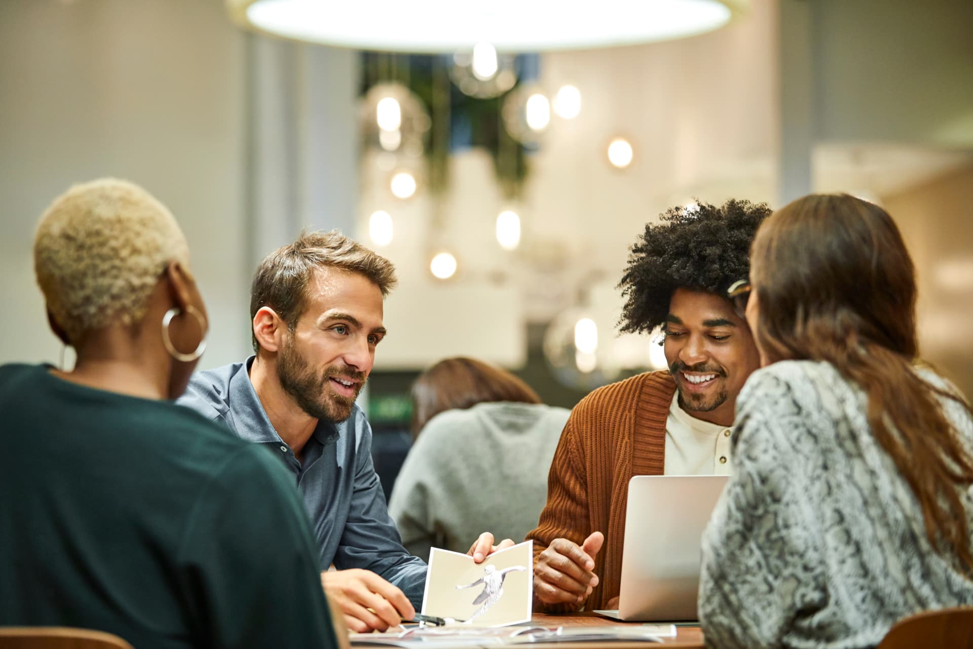 Multi-ethnic coworkers discussing in office