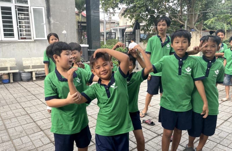 Kids in school uniform posing for picture