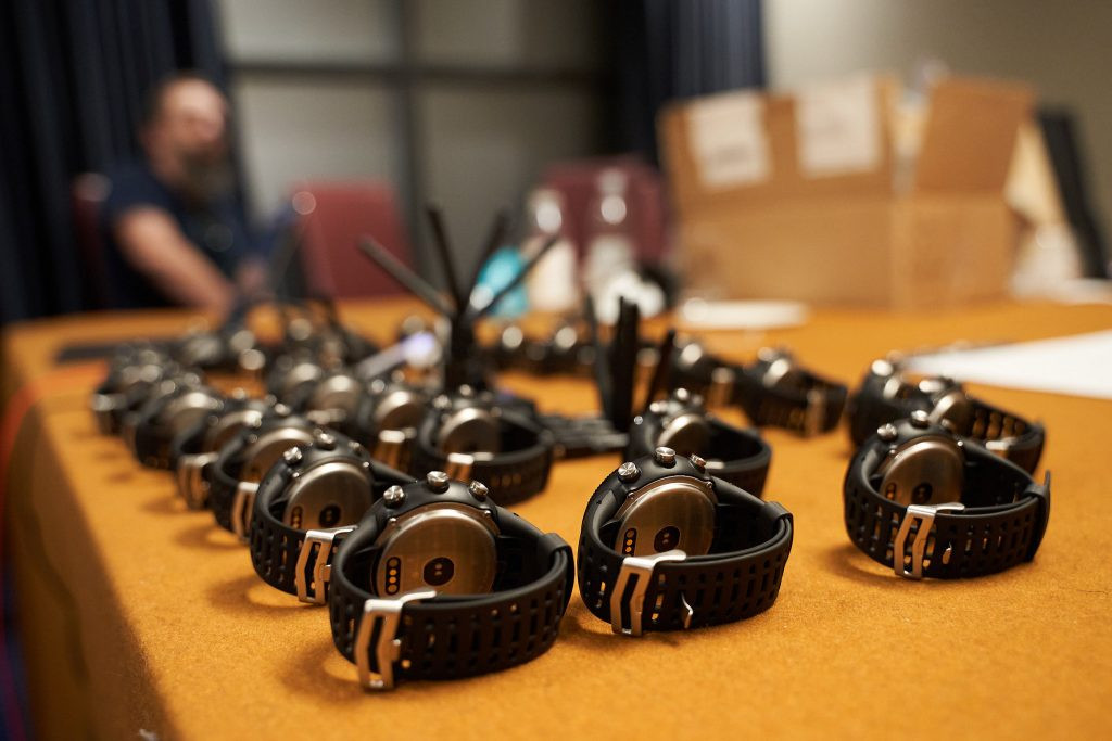 Bangle.js open source watches with tensorflow arranged on a table at nodeconfeu