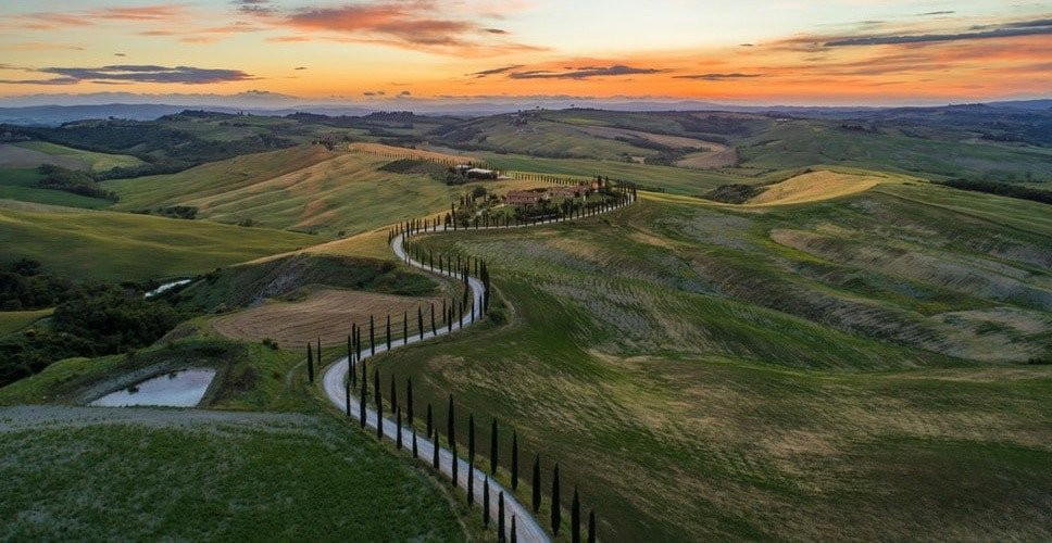 winding road through hills at sunset