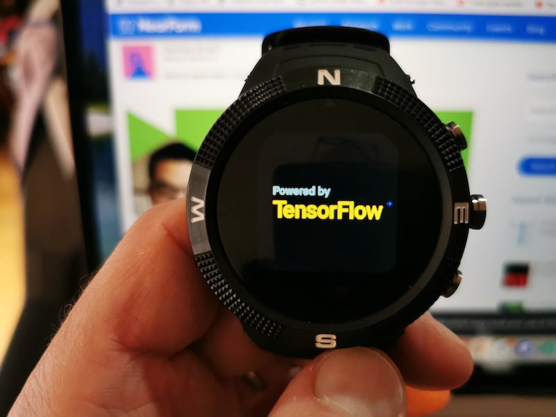 Bangle.js smartwatch displaying powered by tensorflow